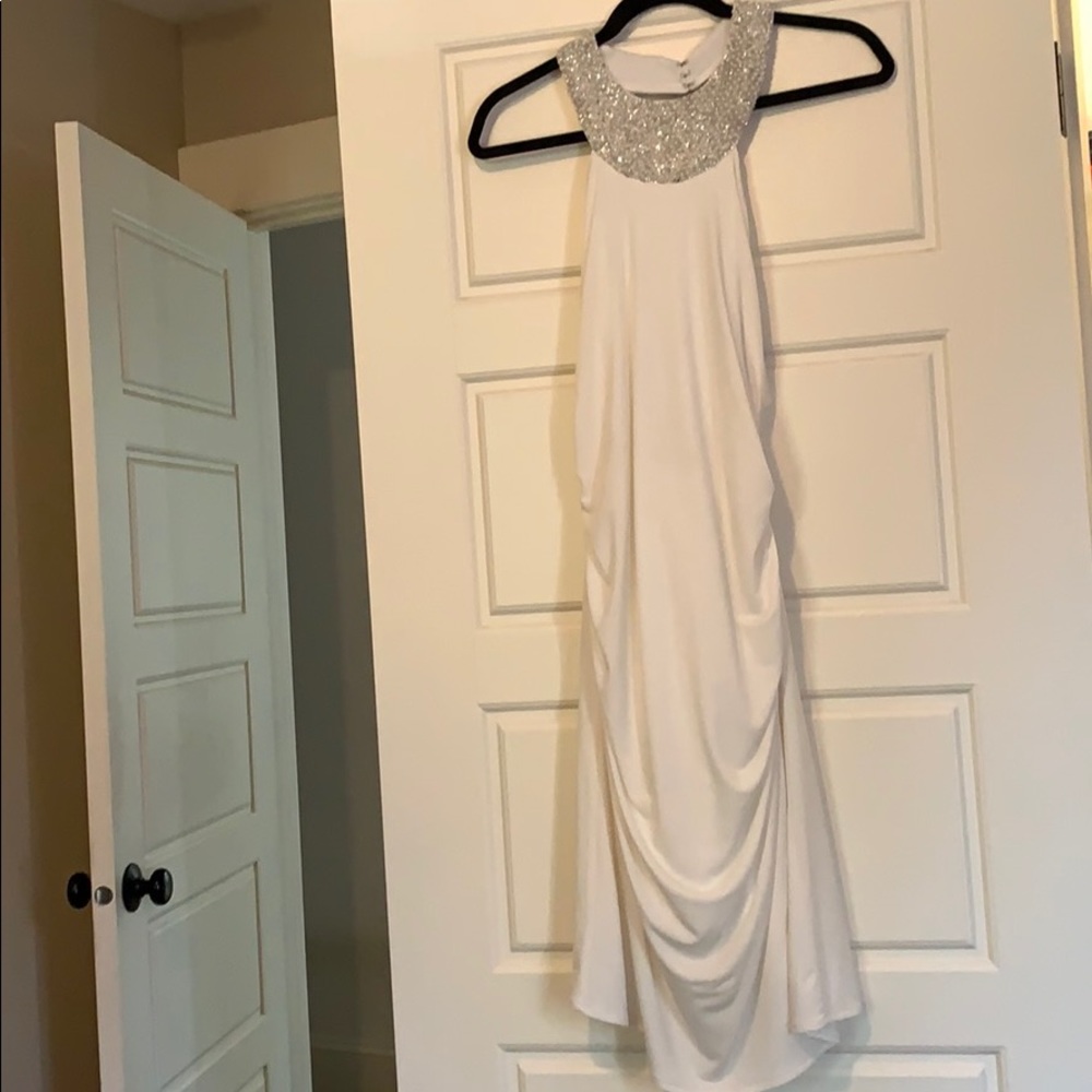 White cocktail dress with pretty beaded details.